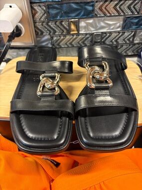 AEROSOLES Black Leather Slide Sandals with Gold Chain Accent